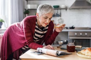 Woman in kitchen reading