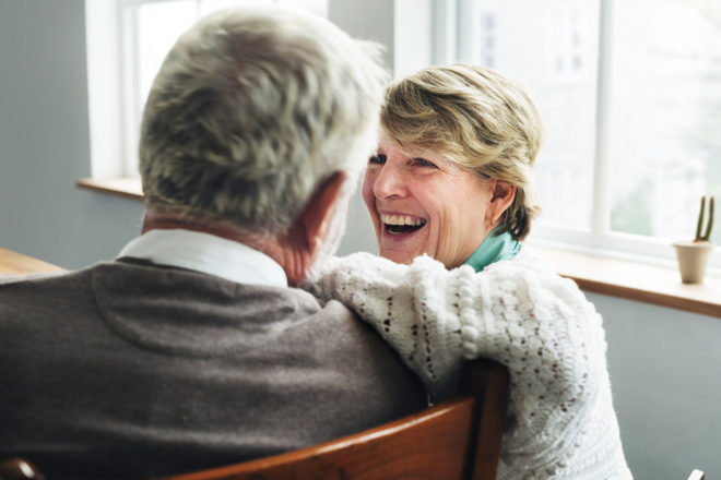 Man and woman in conversation about IRAs at tax time