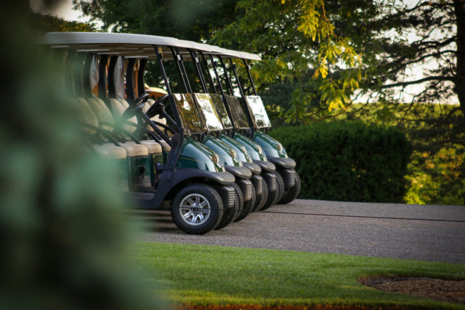 Golf carts ready for golfers in a golf tournament