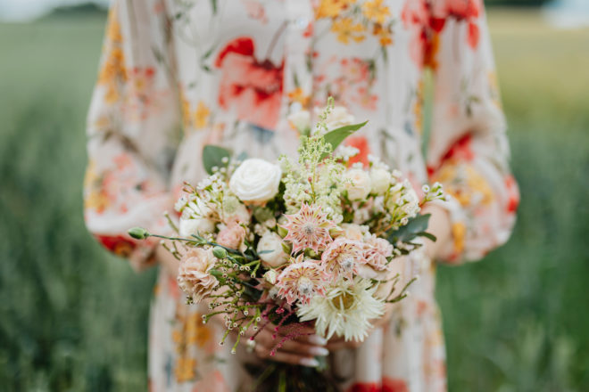 Woman holding colorful flower bouquet