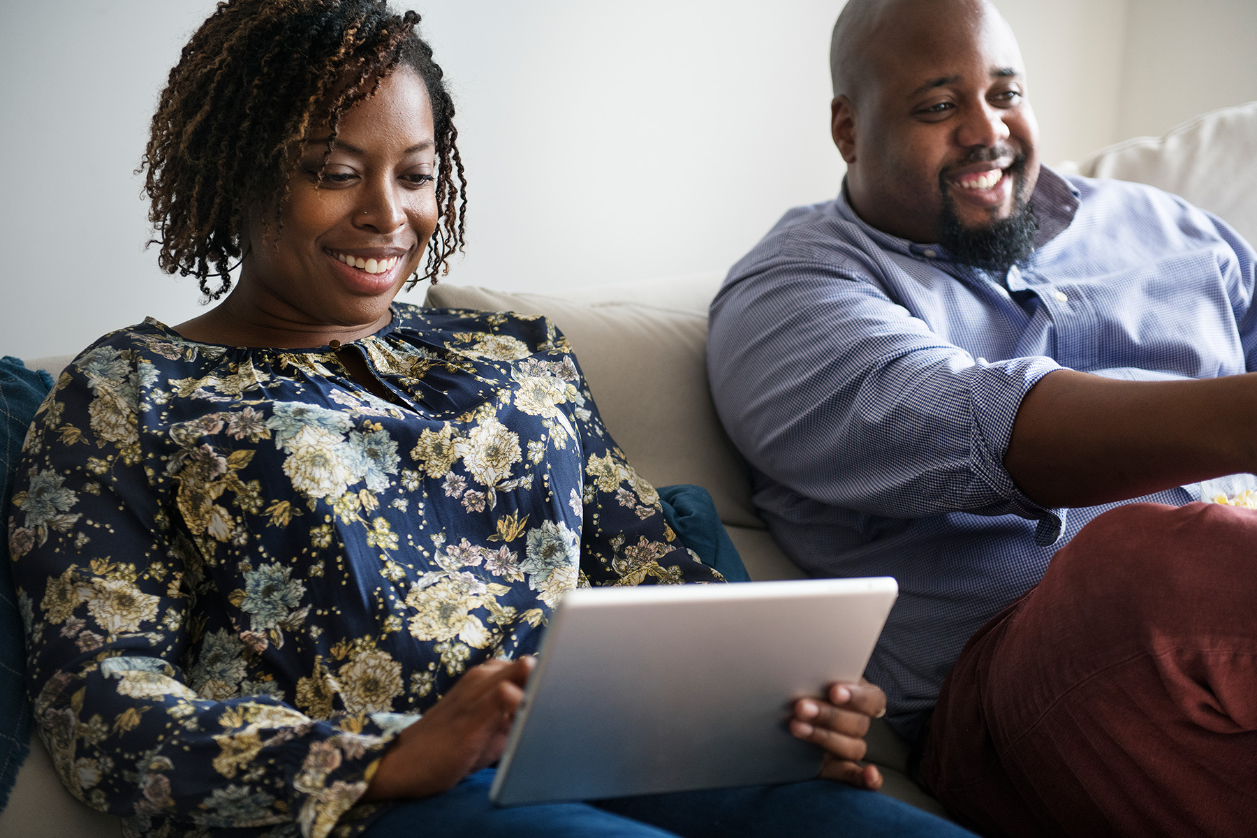 Couple reviewing iPad