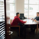 Cetera Financial Advisor, Jason Andrew, meeting with a client in his conference room