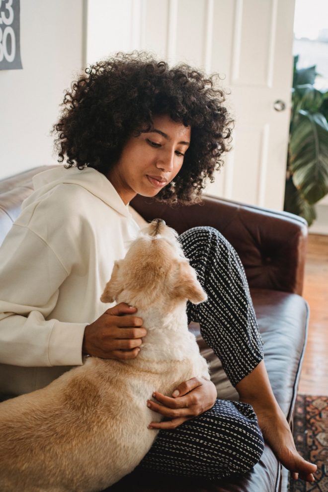 Woman with her dog on the couch