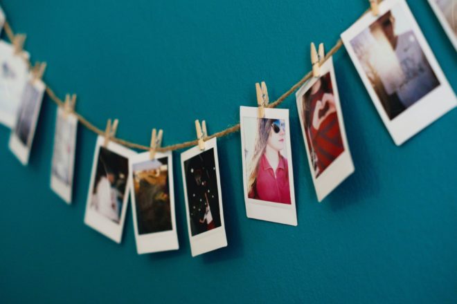 Snap Shot Polaroid photos displayed on a clothesline