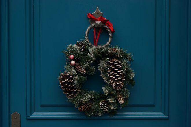 Holiday wreath on a dark teal door