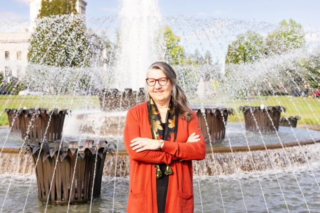 Gaylene VanWey of OlyFed at the Capital Campus fountain at the Olympia State Capitol fountain.