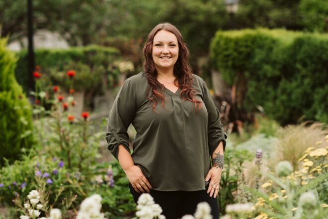 Woman standing in flower garden