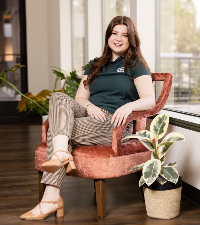 Woman sitting in velvet chair