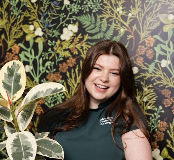 Woman holding a potted plant