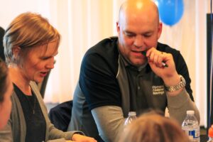 Man and woman working together at a table