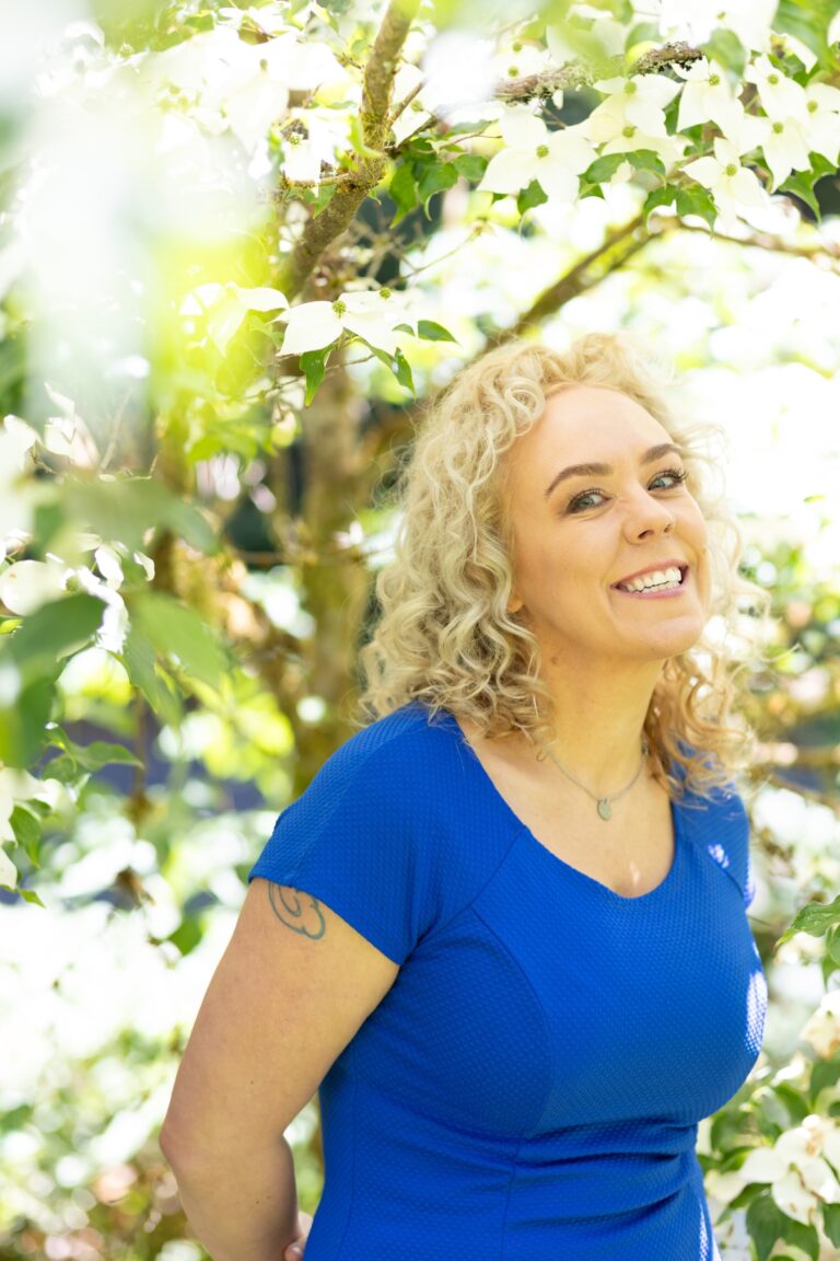 Woman in park by tree