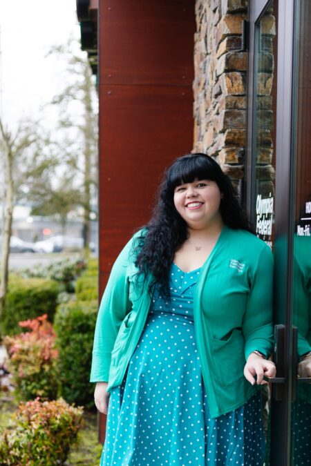 An employee in front of the Westside Branch