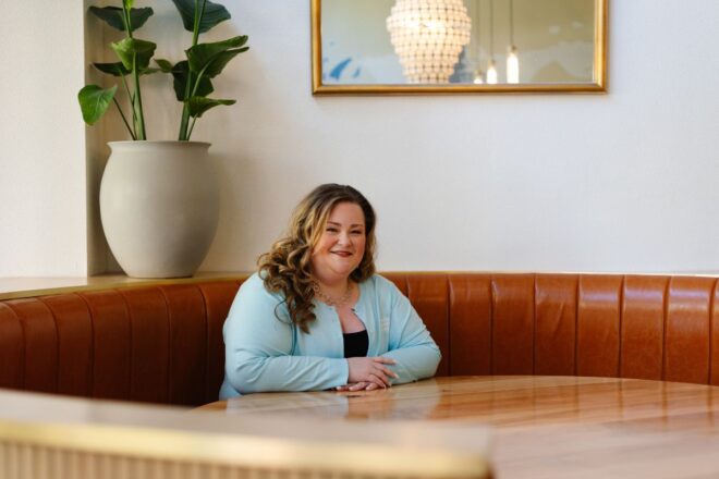 Woman sitting at restaurant table
