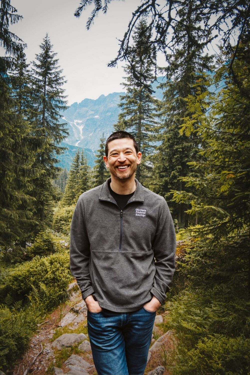 Man standing in woods in the mountains